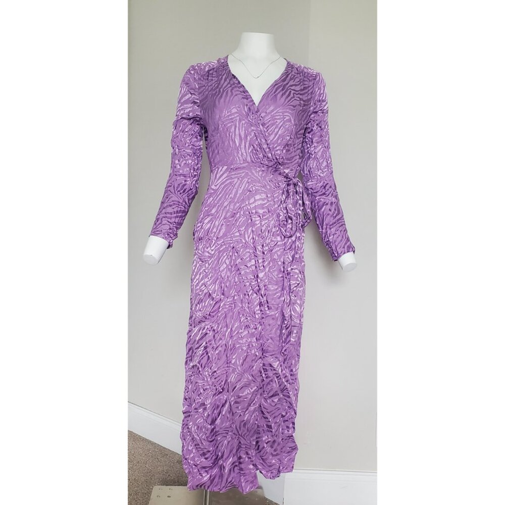 Nasty Gal. New with Tag. Wrap dress. Size 6. Animal print.